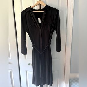 Talbots black jersey dress with self tie and breast pockets. Great for travel!
